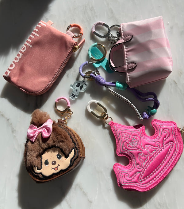 Stacked bag charms with Clip Huggie on each clasp