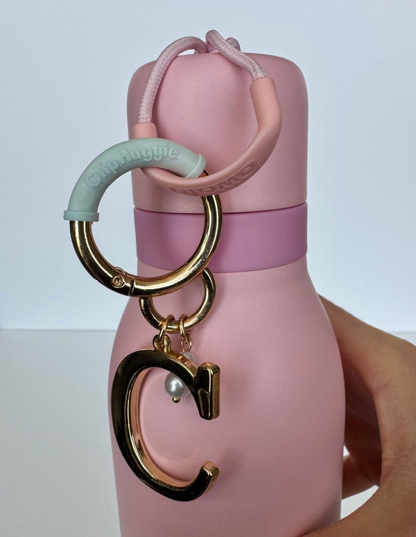Clip Huggie on a water bottle clasp